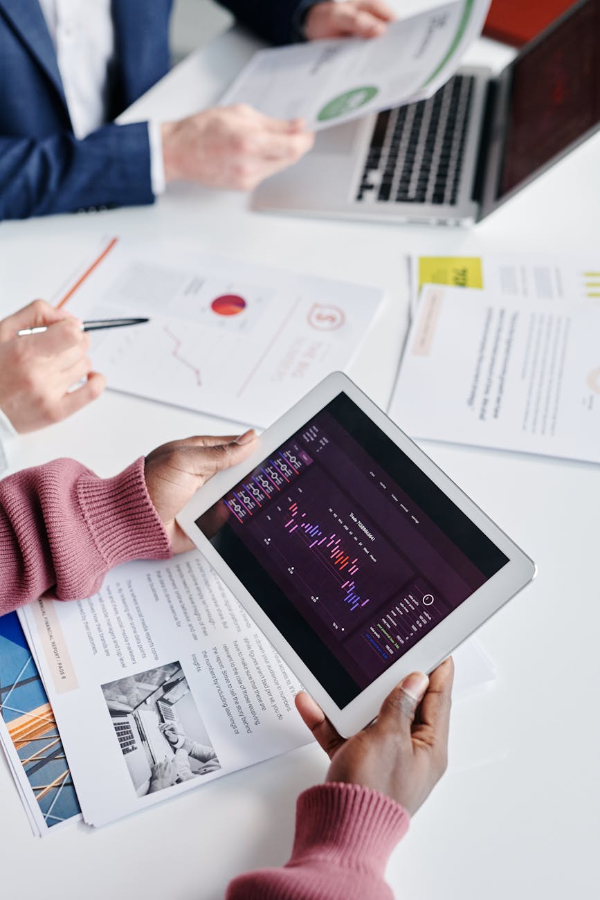 person looking at a data on an ipad